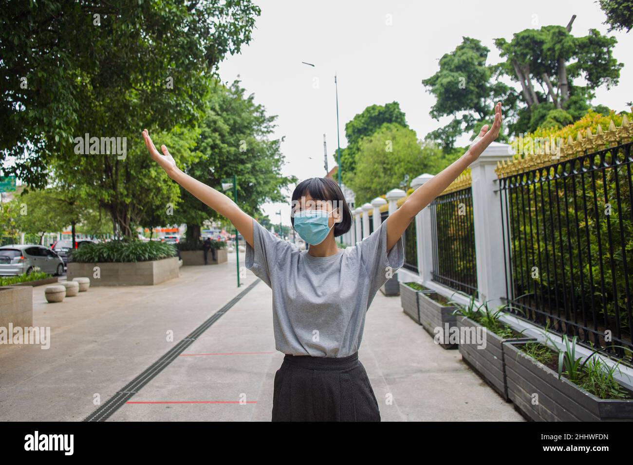 Asian woman wearing medical mask travel around public places Stock Photo