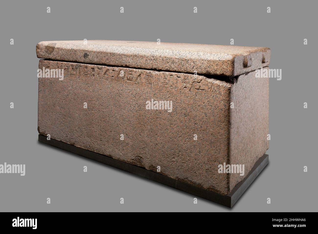 Sarcophagus of Mindjedef ca. 2520–2472 B.C. Old Kingdom Mindjedef, who lived during the mid- to late 4th Dynasty, was buried in a large tomb on the east side of Khufu's pyramid. This red granite sarcophagus was found in the badly disturbed burial chamber, with a dismembered skeleton laid on top of its lid. The outstretched body would have likely been placed directly inside this stone coffer, perhaps laid on his left side and wrapped in linen covered with a layer of plaster in which his limbs and face would have been molded, as was the practice for the elite during this period. The lugs on the Stock Photo