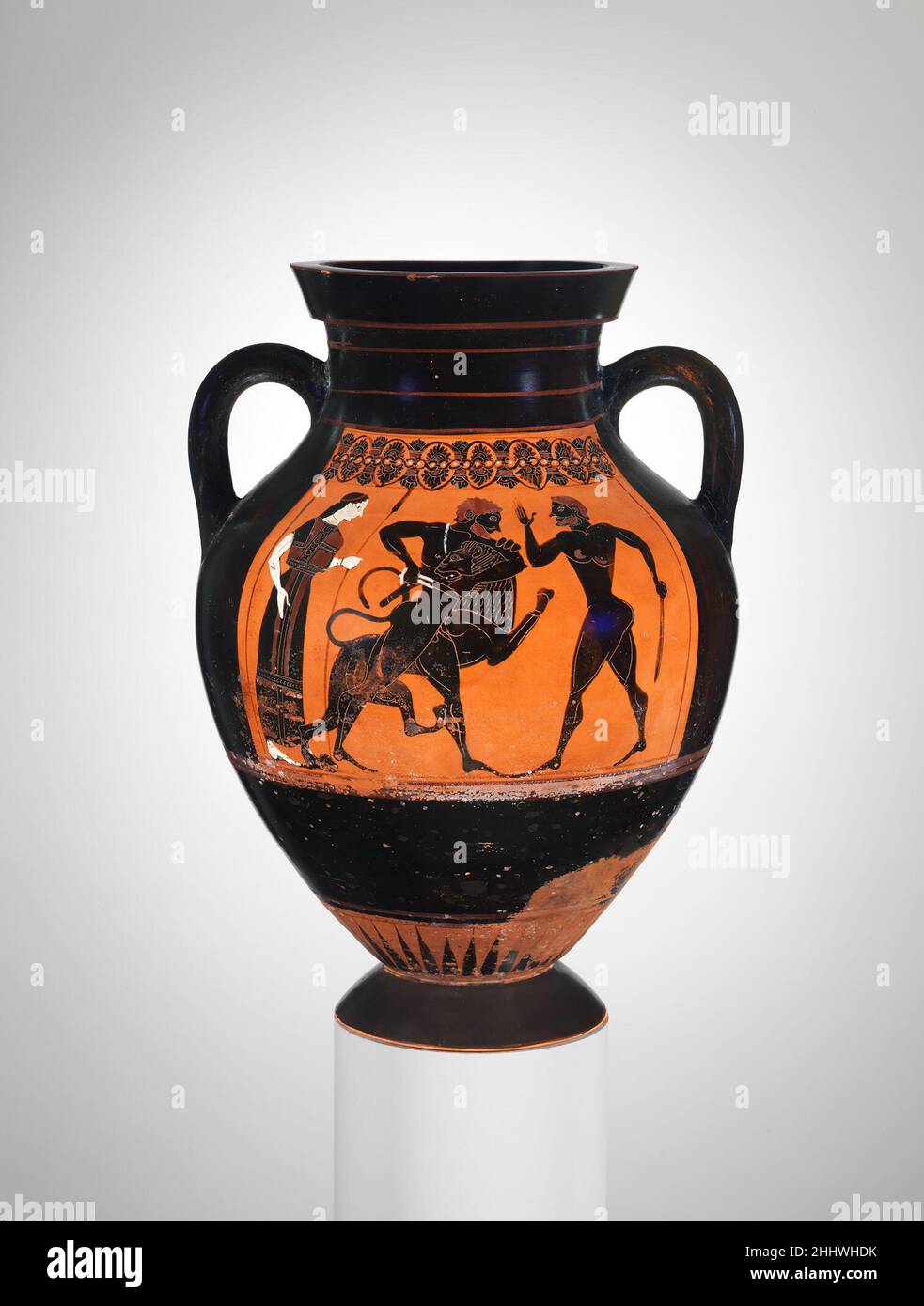 Terracotta amphora (jar) ca. 540 B.C. Attributed to a painter of Group E Obverse, Herakles wrestling the Nemean LionReverse, Herakles fighting GeryonGroup E is the name given to a workshop of painters active during the middle of the sixth century B.C. Exekias, the greatest black-figure artist, began among them. Geryon was a three-bodied creature who lived far to the west with his dog and herd of cattle. One of Herakles' labors was to kill Geryon and bring back the cattle.. Terracotta amphora (jar)  254869 : Attributed to a painter of Group E, Terracotta amphora (jar), ca. 540 B.C., Terracotta, Stock Photo
