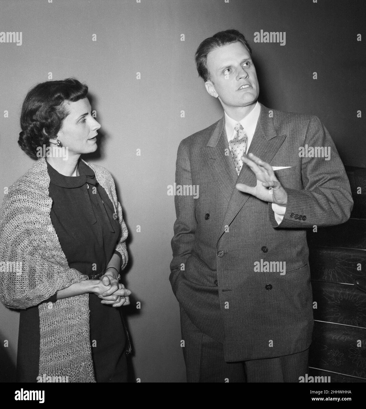 American evangelist Billy Graham with his wife Ruth at the Central Hall in Westminster, London where he addressed a press conference at the start of his there month London crusade.  25th February 1954. Stock Photo