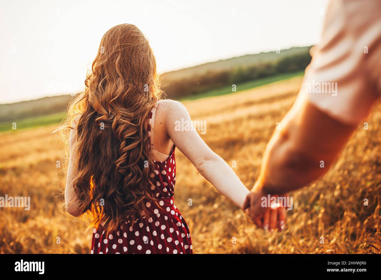 Woman hold hand rear view hi-res stock photography and images - Alamy