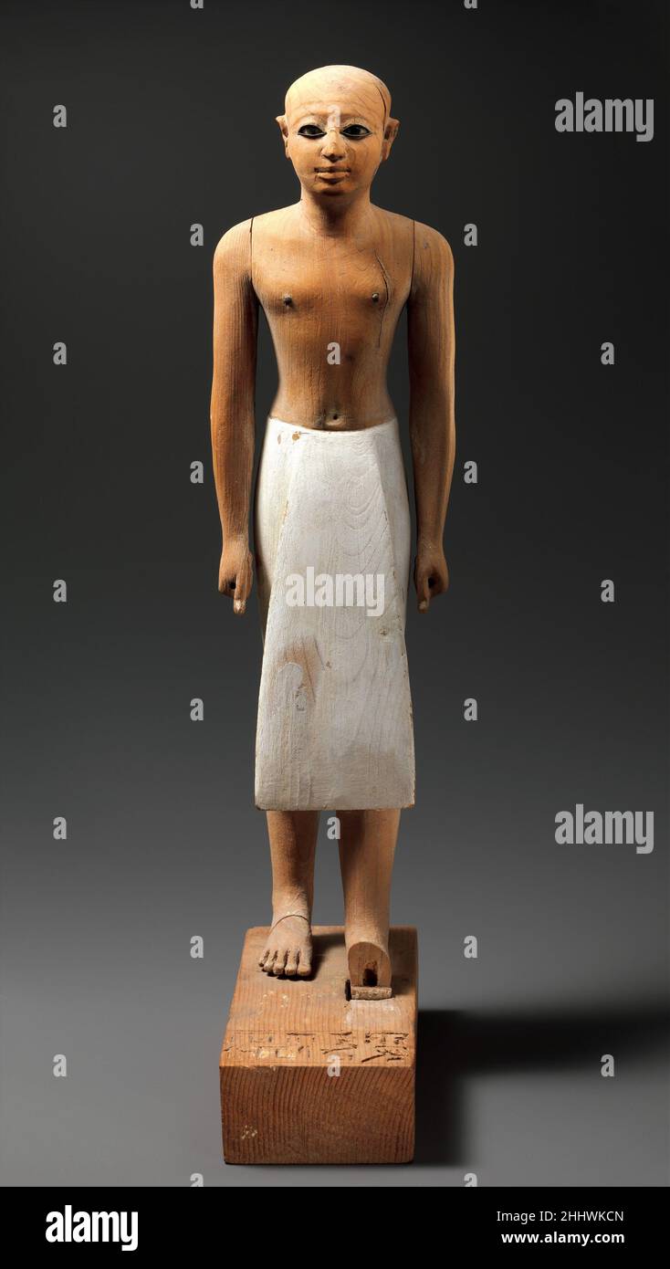 Statuette of the Steward Senbi ca. 1981–1885 B.C. Middle Kingdom On the front of the base is written: ' Large invocation offerings of bread and beer, cattle and fowl for the ka (life force) of the honored steward Senbi.'. Statuette of the Steward Senbi  545477 Stock Photo