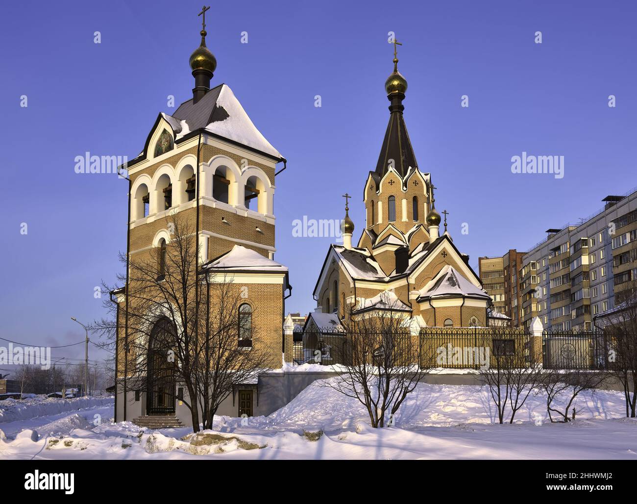 Church of St. Andrew in the area of Springs. Morning pink light, Russian style, crosses on Golden domes, bell tower in the form of a tower with a pict Stock Photo