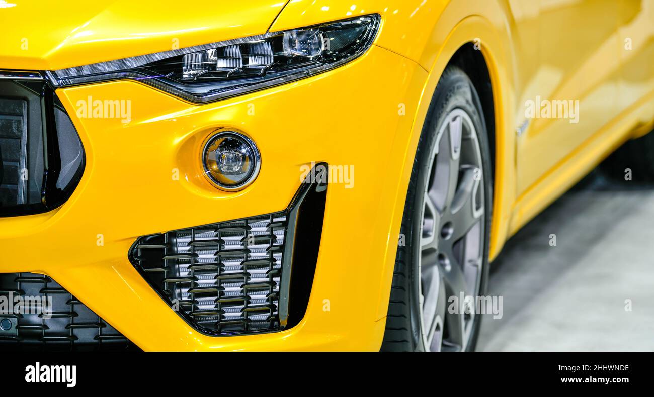 Yellow modern car headlights on black background Stock Photo Alamy