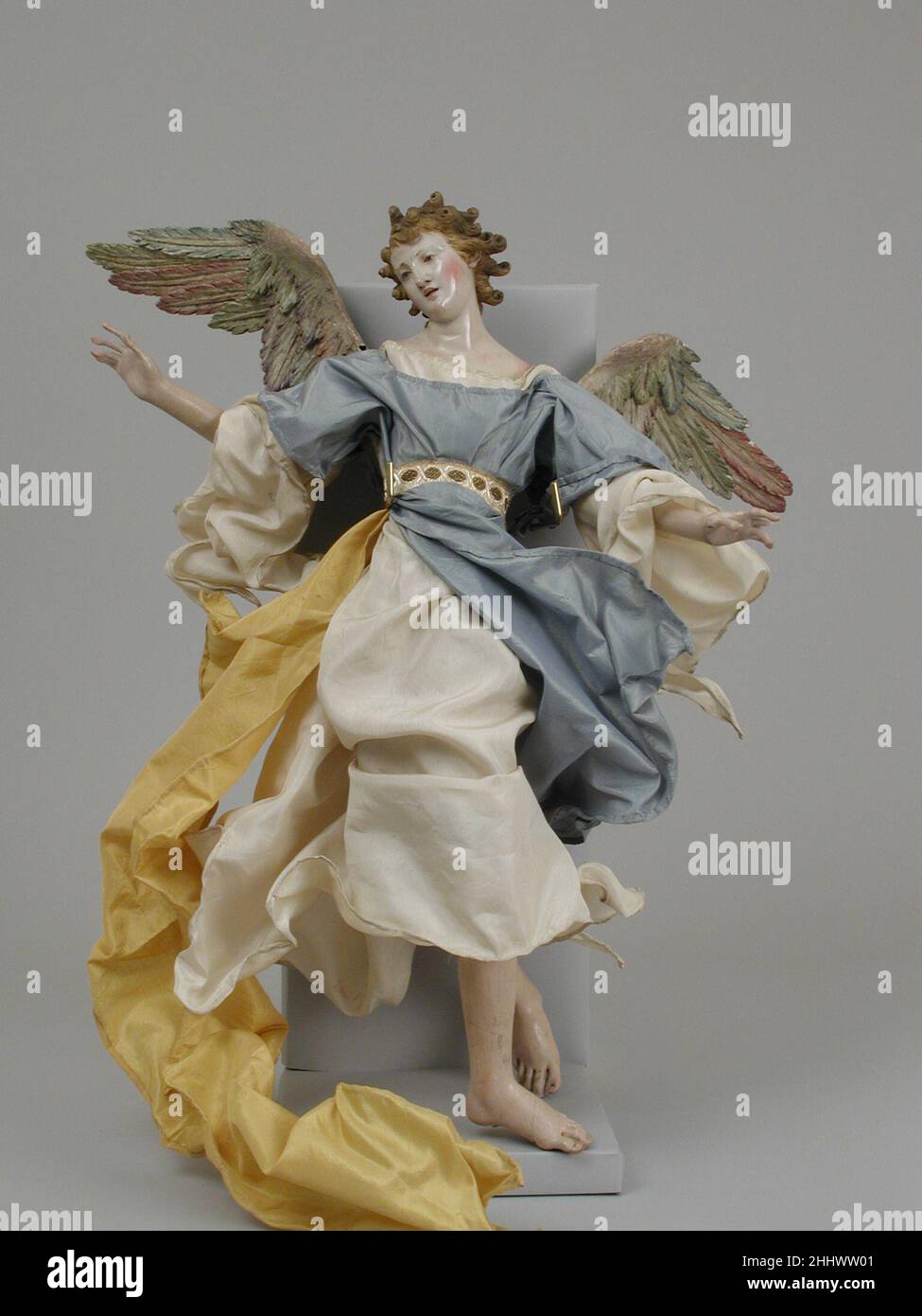 Angel late 18th–early 19th century Italian, Naples. Angel. Italian, Naples. late 18th–early 19th century. Polychromed wood and terracotta; silk robes. Crèche Stock Photo