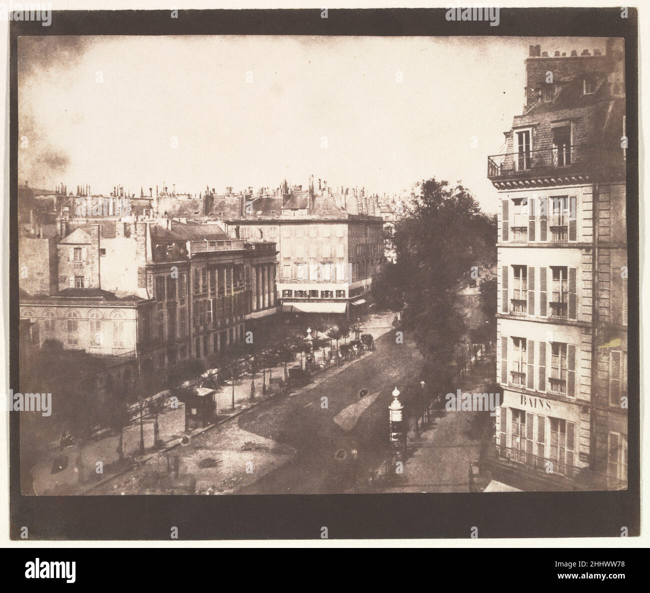 View of the Boulevards of Paris 1843 William Henry Fox Talbot British In May 1843 Talbot traveled to Paris to negotiate a licensing agreement for the French rights to his patented calotype process. His invention used a negative-positive system and a paper base—not a copper support as in a daguerreotype. Although his negotiations were not fruitful, Talbot’s views of the elegant new boulevards of the French capital were highly successful.Filled with the incidental details of urban life, architectural ornamentation, and the play of spring light, this photograph appears as the second plate in Talb Stock Photo