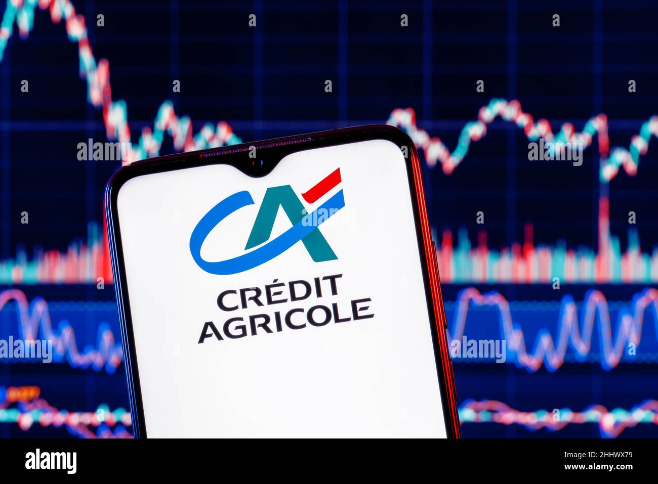 Smartphone with Credit Agricole bank logo. Credit Agricole stock chart on  the background Stock Photo - Alamy