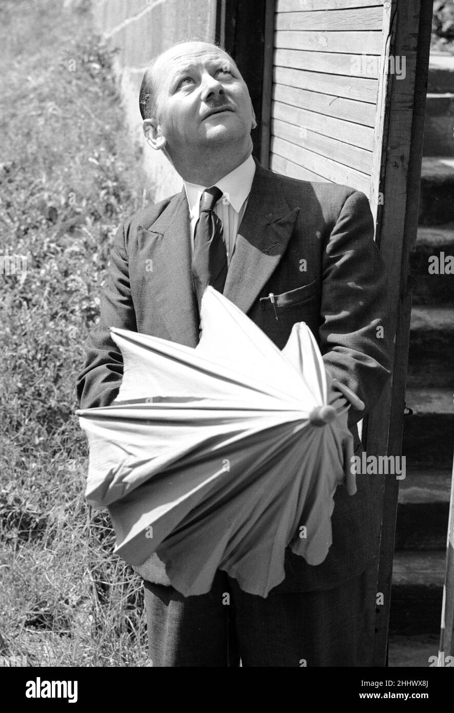 Mr W Davis of Priory Hill Dartford, Kent is doubtful about the weather. 10th August 1953 Stock Photo