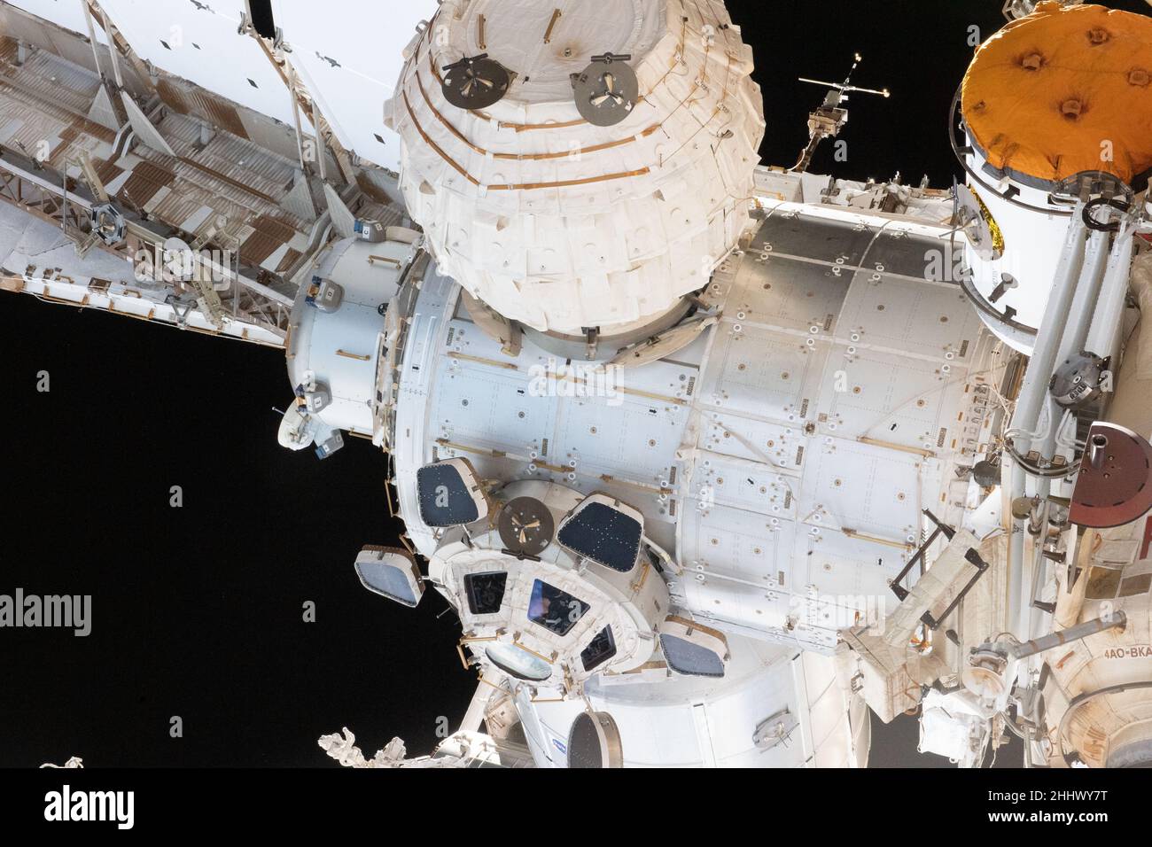 Earth Atmosphere. 16th Jan, 2022. NASA astronaut and Expedition 66 Flight Engineer Kayla Barron peers out from a window inside the cupola, the International Space Station's 'window to the world.' Prominent components in this photograph include the Tranquility module to which the cupola is attached to and the BEAM module. Credit: NASA/ZUMA Press Wire Service/ZUMAPRESS.com/Alamy Live News Stock Photo