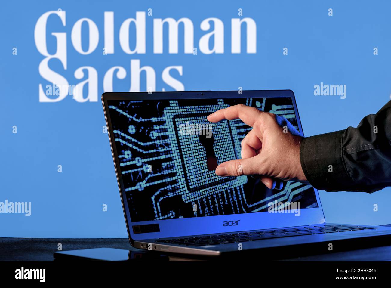 Laptop with lock symbol on screen on background of Goldman Sachs bank