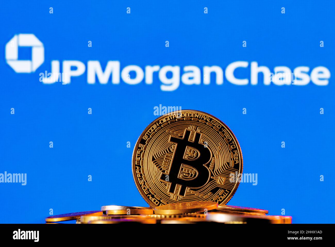 Golden bitcoin in a pile of coins on the background of Chase bank logo Stock Photo Alamy