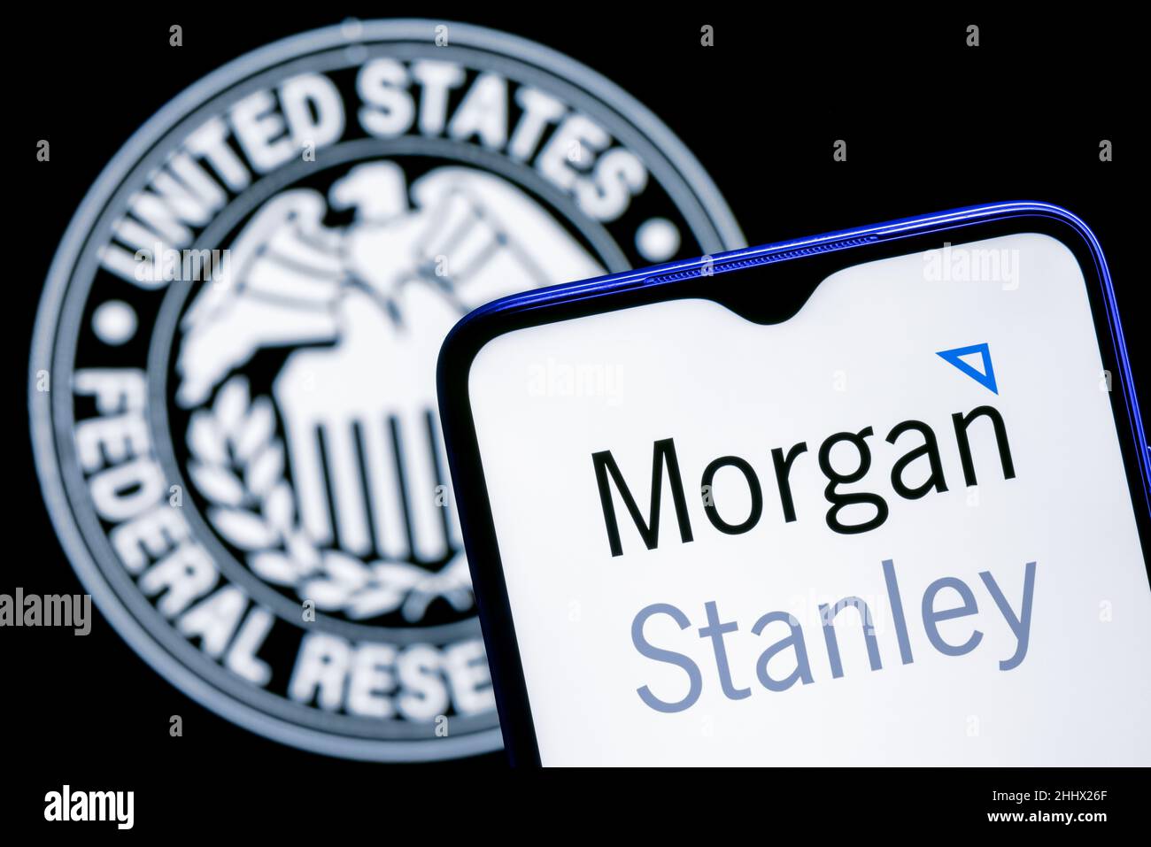 Smartphone with Morgan Stanley bank logo on background of Federal Reserve symbol Stock Photo