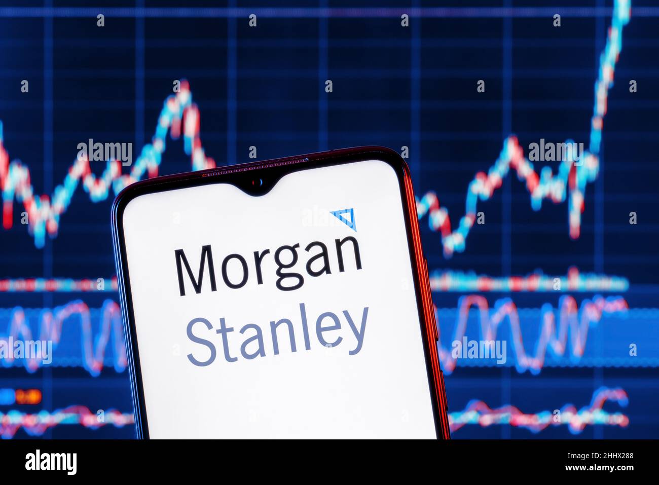 Smartphone with Stanley bank logo. Stanley stock chart on