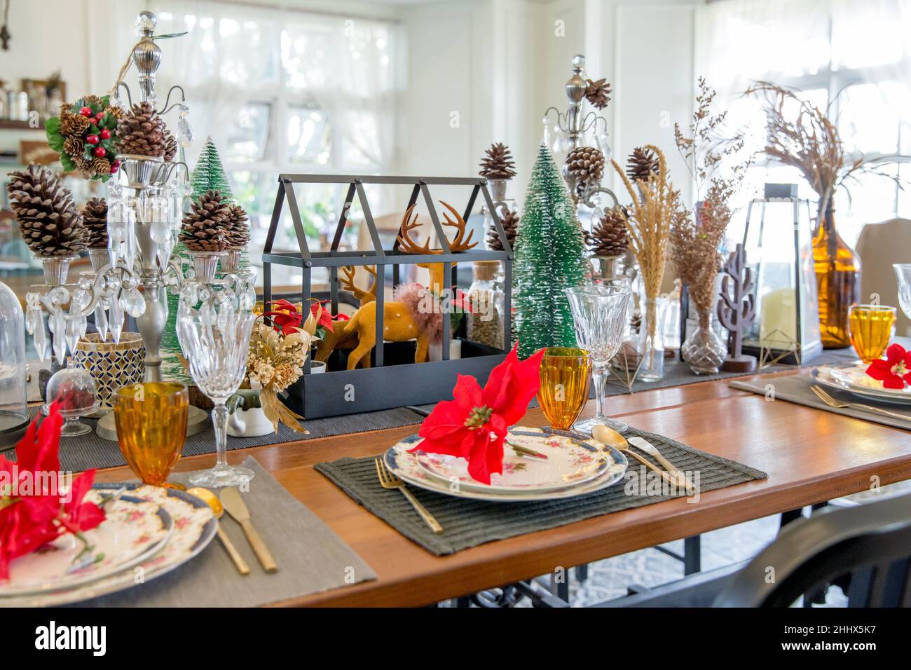 Christmas dinner table setup with decoration, focus selective Stock