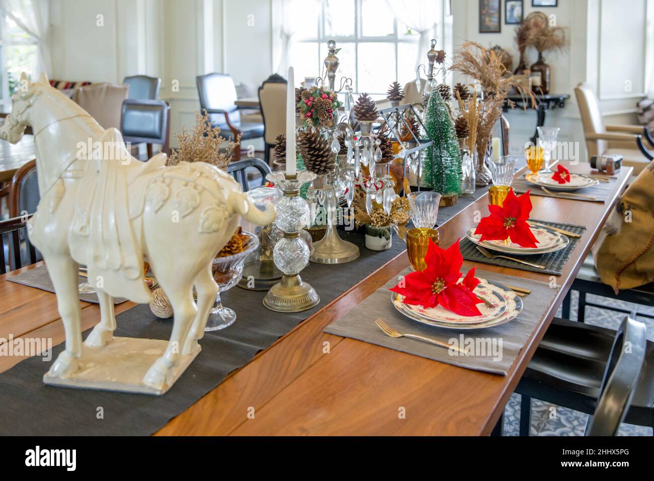 Christmas dinner table setup with decoration, focus selective Stock