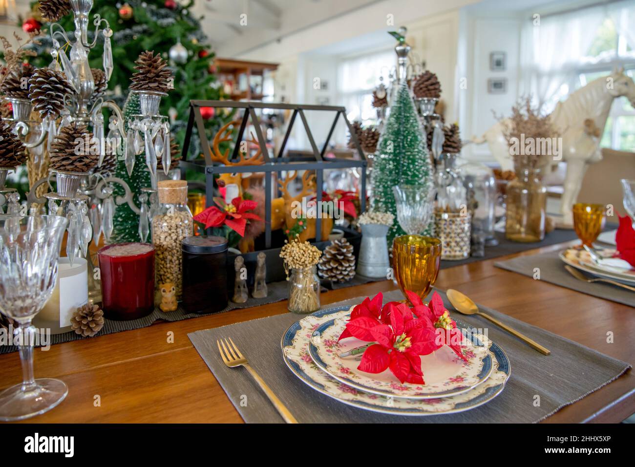 Christmas dinner table setup with decoration, focus selective Stock