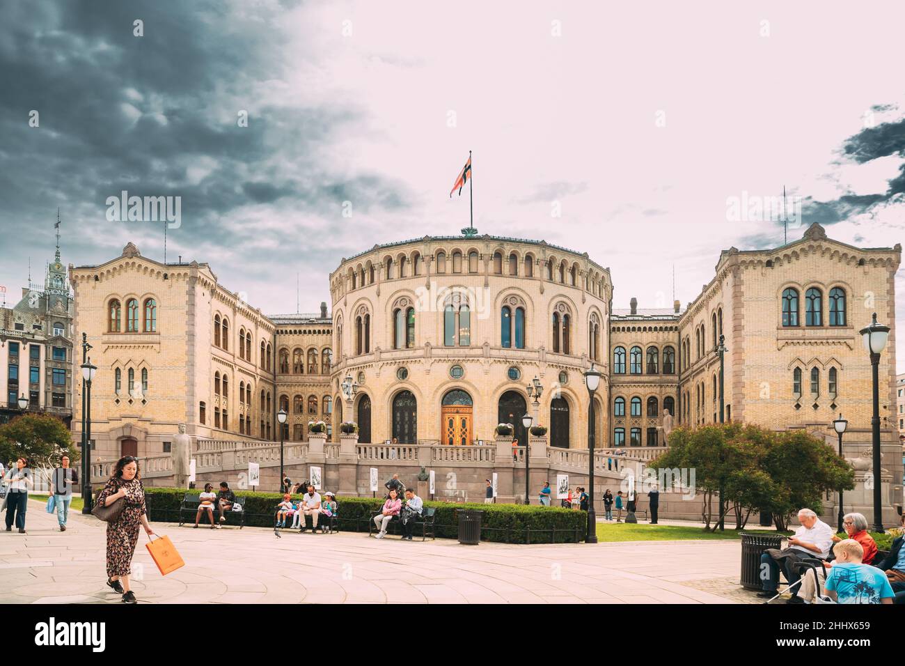 Oslo, Norway. People Walking Near Oslo Parliament. Storting building or Stortingsbygningen. Famous And Popular Place. Stock Photo