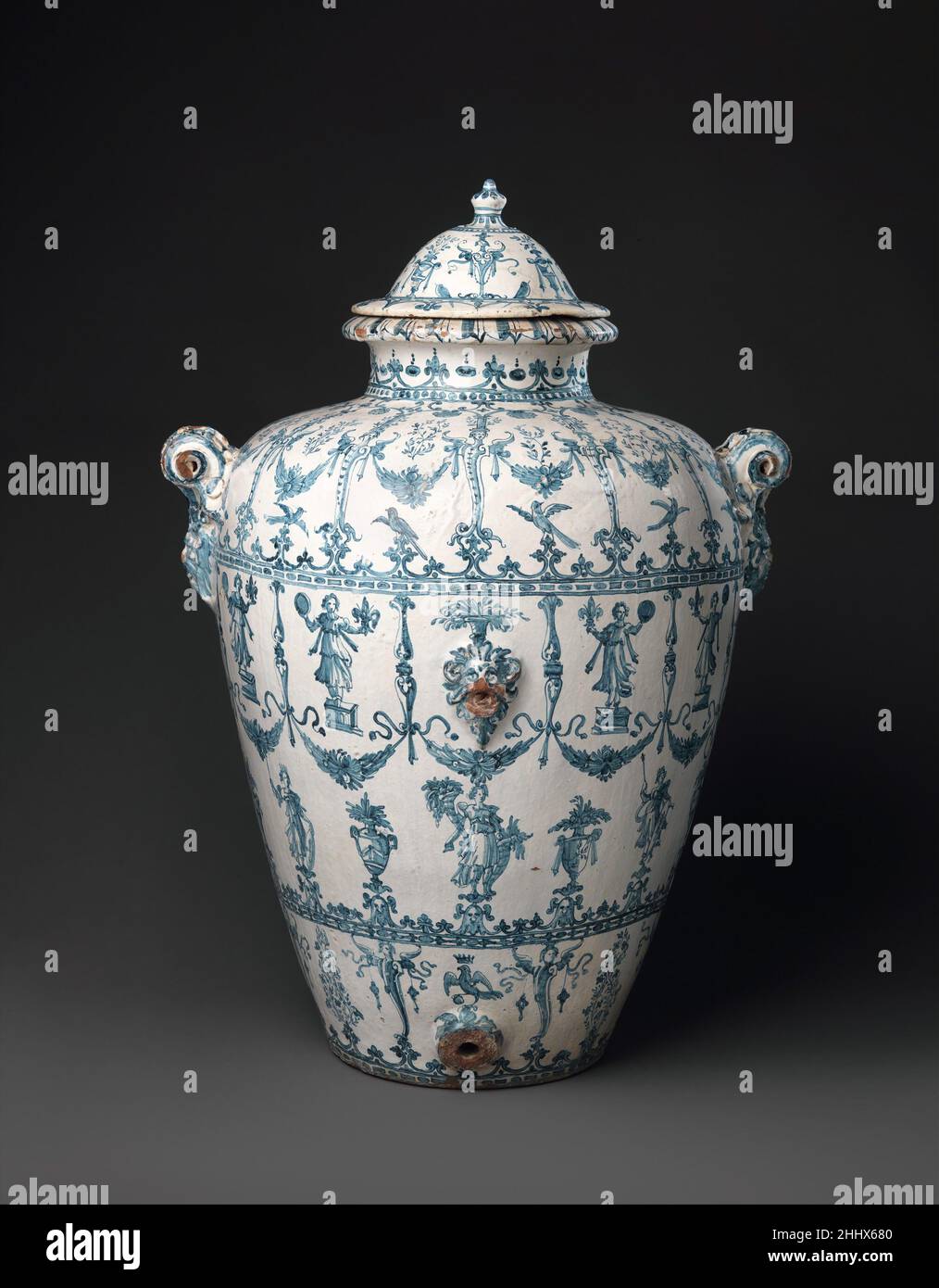Wine jar (Orcio da vino) ca. 1597–1620 workshop of the Marmi family The only known examples of Montelupo ware with monochrome blue decoration on a near-white ground. That combination recalls the porcelain that had been the pride of Grand Duke Francesco I de’ Medici in Florence. Bernardo Buontalenti was in charge of that enterprise. These large jars, therefore, represent a prolongation of that local tradition, even though the material, size, and style differ. The latter can be associated with Buontalenti’s principal pupil, Giulio Parigi, who also worked for the Medici. Hence we are tempted to c Stock Photo