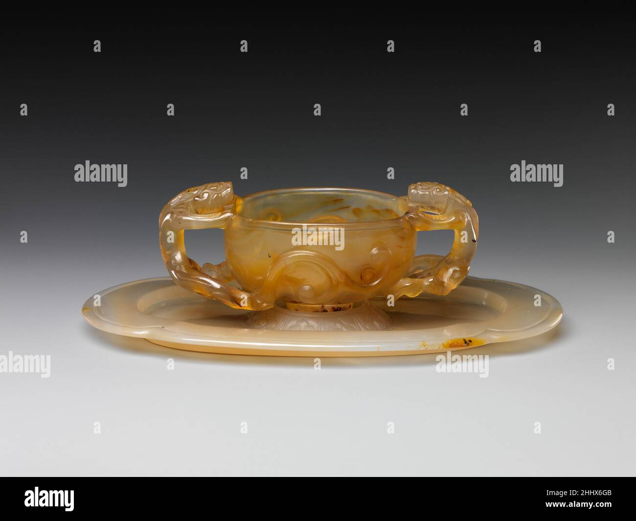 Cup with dragon handles and saucer 18th century China. Cup with dragon