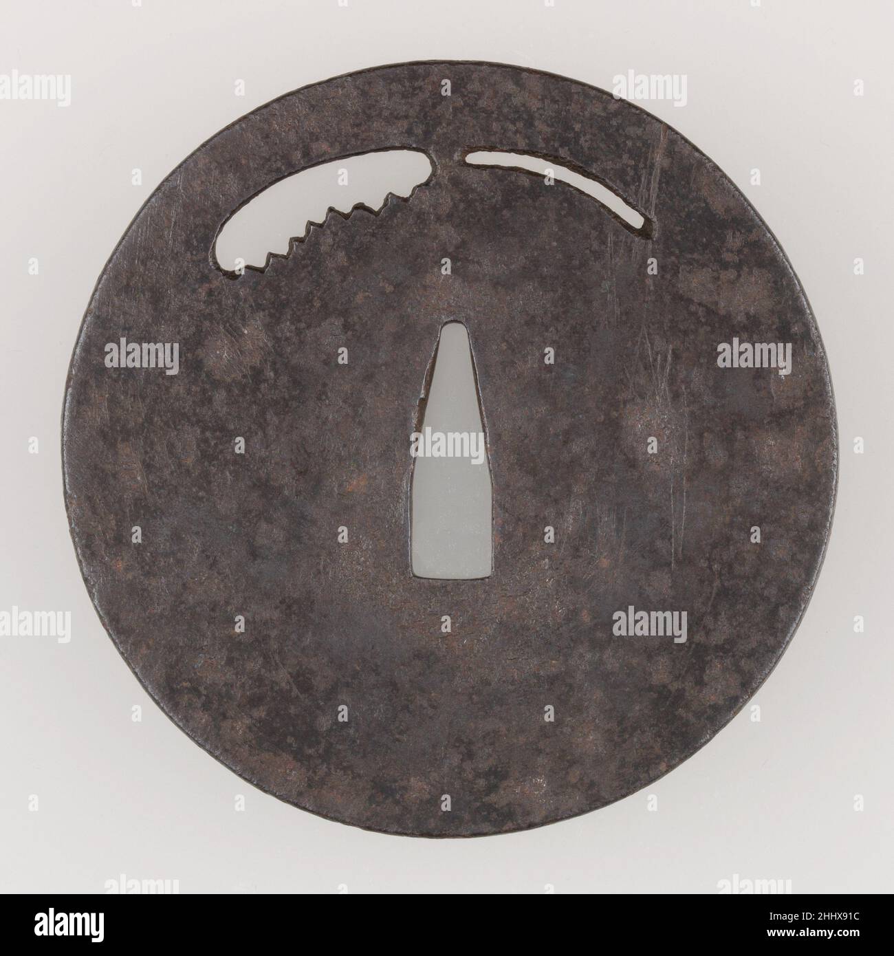 Sword Guard (Tsuba) late 14th century Japanese This tsuba features an openwork design of a saw. It is made in the so-called kō-toshō (swordsmith's) style.. Sword Guard (Tsuba)  31704 Stock Photo