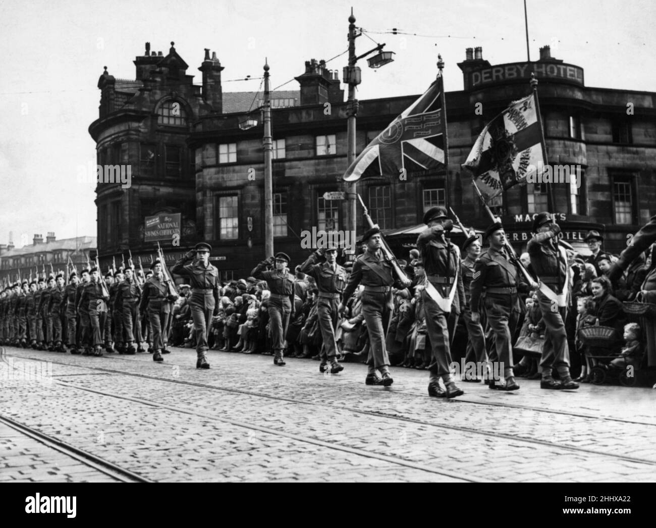 Soldiers of the 1st Battalion Lancashire Fusiliers seen here marching through the centre of Bury to the regimental depot at Wellington Barracks. Circa 1950 Stock Photo