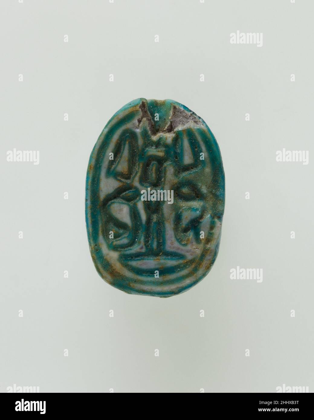 Scarab Inscribed with Hieroglyphs ca. 1850–1640 B.C. Middle Kingdom The scarab is inscribed with a symmetric arrangement of hieroglyphs, not meant to form words but chosen instead for their positive meaning. Such compositions are particularly prevalent on design scarabs of the late Middle Kingdom (late Dynasty 12–Dynasty 13, ca. 1850 –1640 B.C.). They serve as models for the wide array of variations seen on Egyptian scarabs of the Second Intermediate Period (Dynasty 14–17, ca. 1640–1550 B.C.) and on Canaanite scarabs (Middle Bronze Age IIB-IIC, ca. 1700–1500 B.C.).. Scarab Inscribed with Hiero Stock Photo