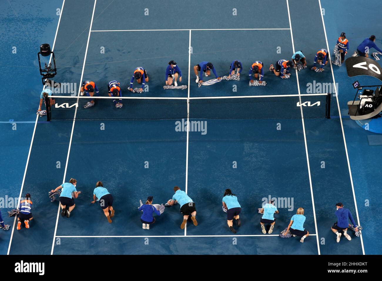 Tennis - Australian Open - Melbourne Park, Melbourne, Australia - January  26, 2022 Ball kids and officials dry the court as rain stops play  REUTERS/Loren Elliott Stock Photo - Alamy