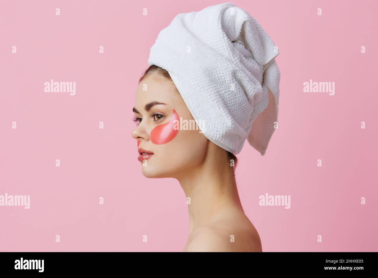 woman-pink-patches-on-the-face-with-a-towel-on-the-head-isolated