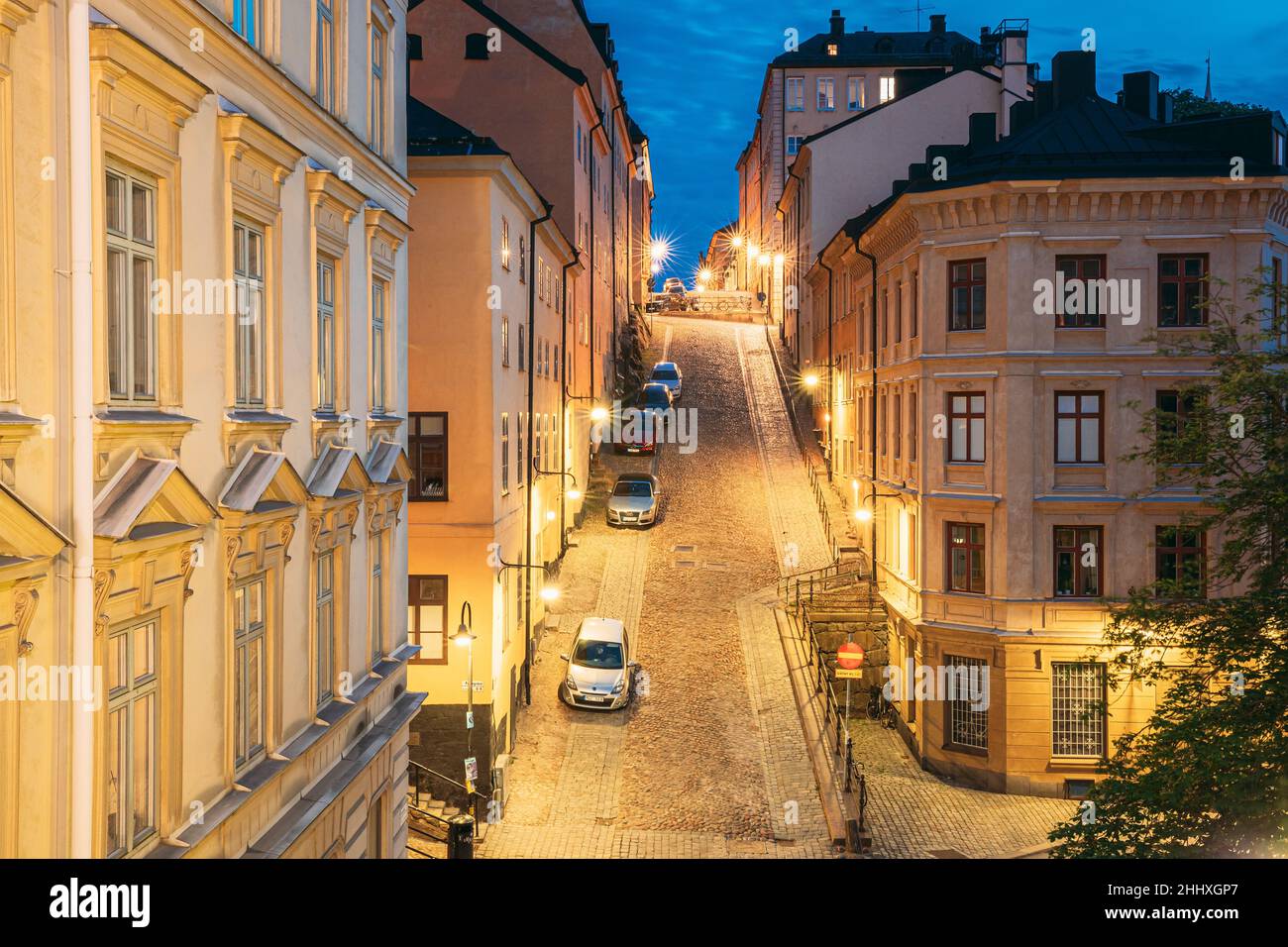 Stockholm, Sweden. Night View Of Traditional Stockholm Street. Residential Area, Cozy Street In Downtown. District Mullvaden First In Sodermalm. Cars Stock Photo