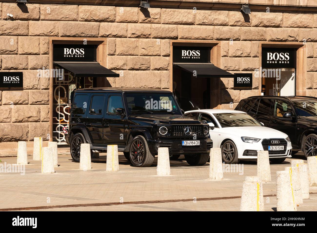 Expensive cars outside the Hugo Boss official store in Saborna Street, Sofia, Bulgaria Stock Photo