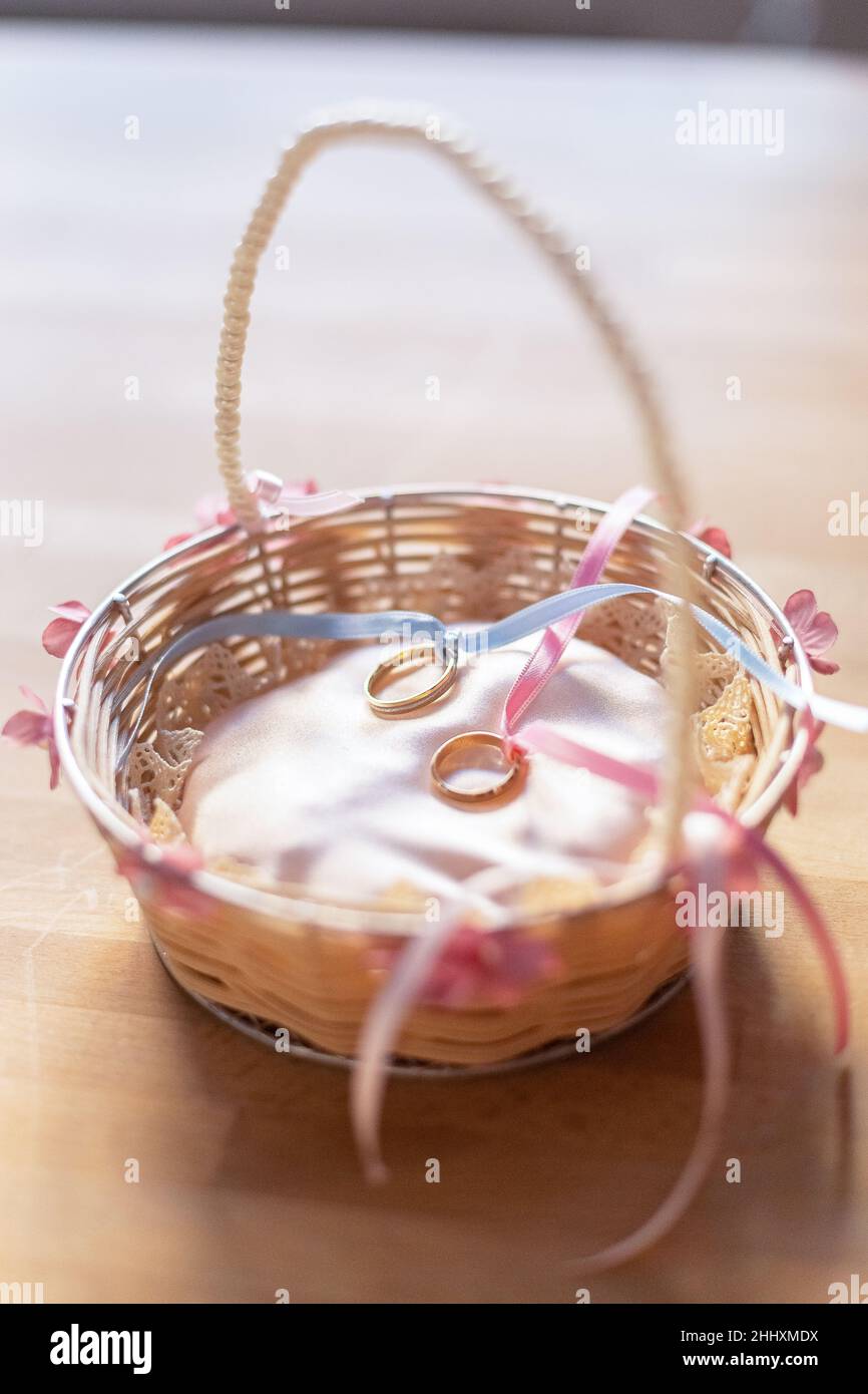 A decorated basket with wedding rings Stock Photo