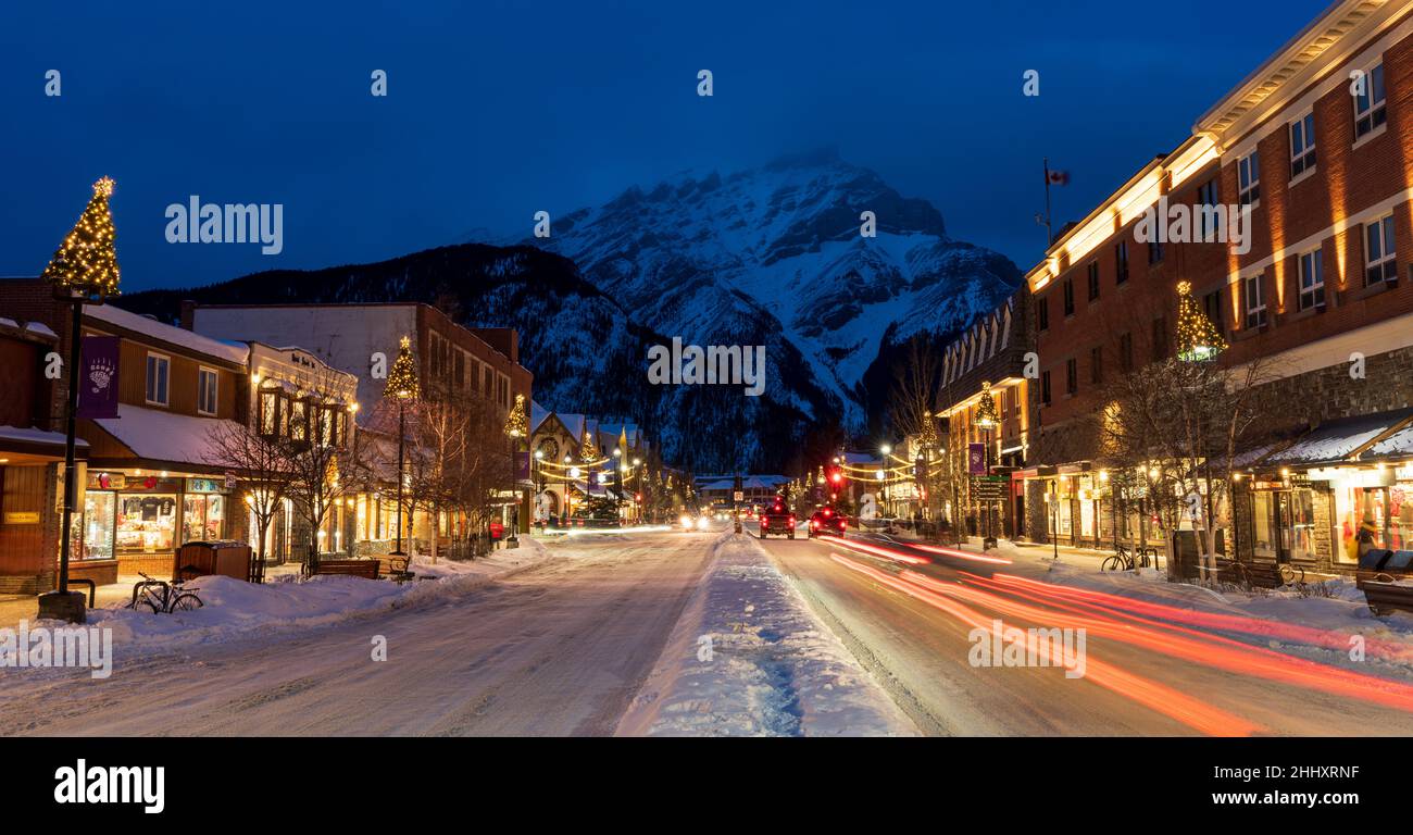 Town of Banff, Alberta, Canada - January 10 2022 : Downtown Banff Avenue in winter night. Stock Photo