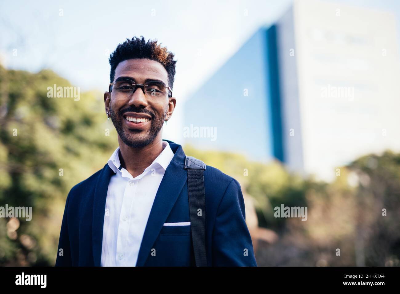 Portrait of young black male worker looking at camera on the street Stock Photo