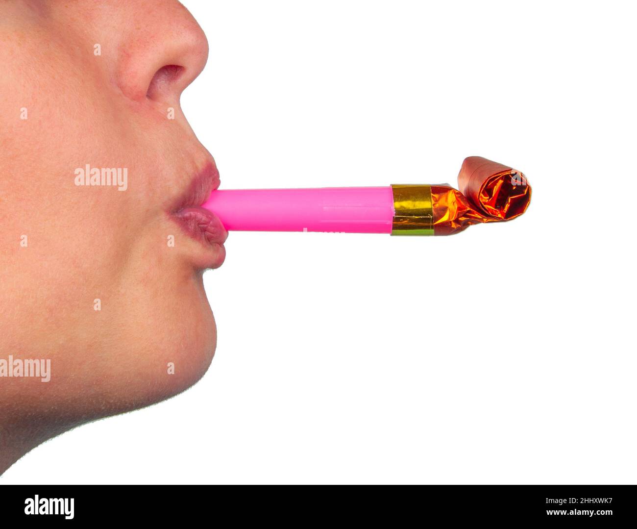 Foil whistle horn or noisemaker in mouth on the white Stock Photo Alamy