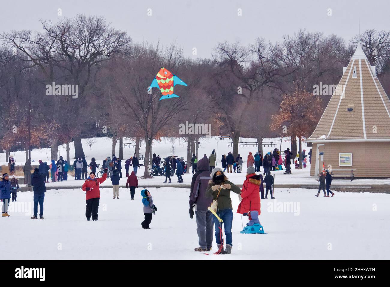 Lake Harriet Winter Kite Festival on frozen lake, in January. Fun recreation in cold weather and freezing temperature. Minneapolis, Minnesota. Stock Photo