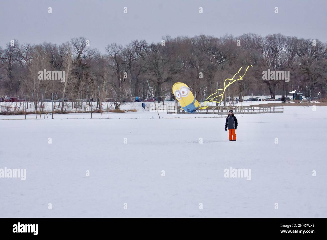 Lake Harriet Winter Kite Festival on frozen lake, in January. Fun recreation despite cold weather and freezing temperature. Minneapolis, Minnesota. Stock Photo