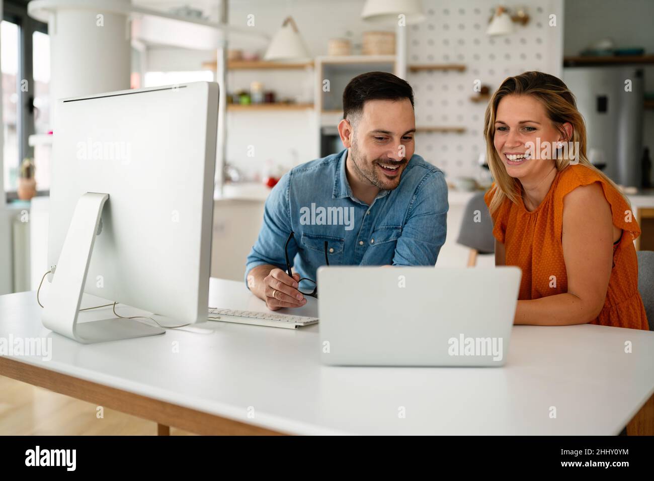 Programmers cooperating at IT company developing apps Stock Photo