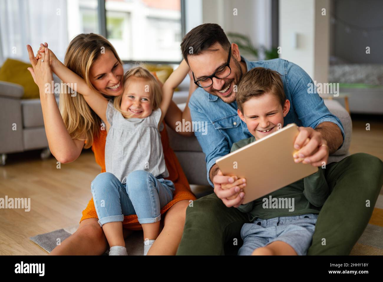Device technology family online education concept. Happy family with ...