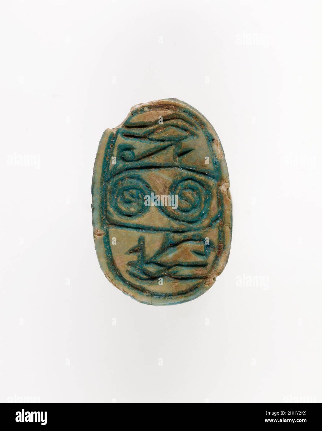Scarab with Wedjat and Scroll Decoration ca. 1850–1640 B.C. Middle Kingdom The majority of design scarabs of the late Middle Kingdom (late Dynasty 12–Dynasty 13, ca. 1850 –1640 B.C.) are decorated with symmetric compositions of protective hieroglyphs and/or scrolls. This scarab shows wedjat-eyes on either side of a scroll. As the healed eye of Horus, the wedjat is a powerful symbol, representing health and regeneration.. Scarab with Wedjat and Scroll Decoration  557101 Stock Photo