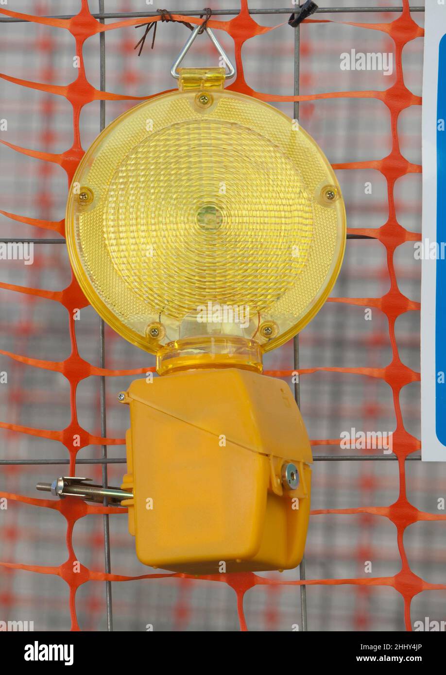 Emergency Flashing LED hanging on welded Wire. Construction site