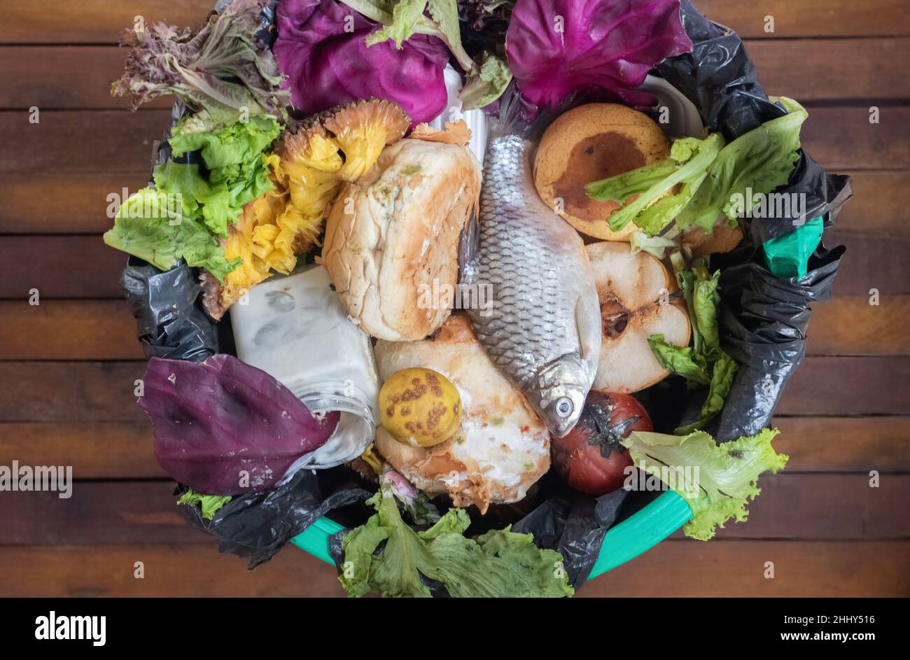 A garbage can with unused food. Food waste as a global problem in the