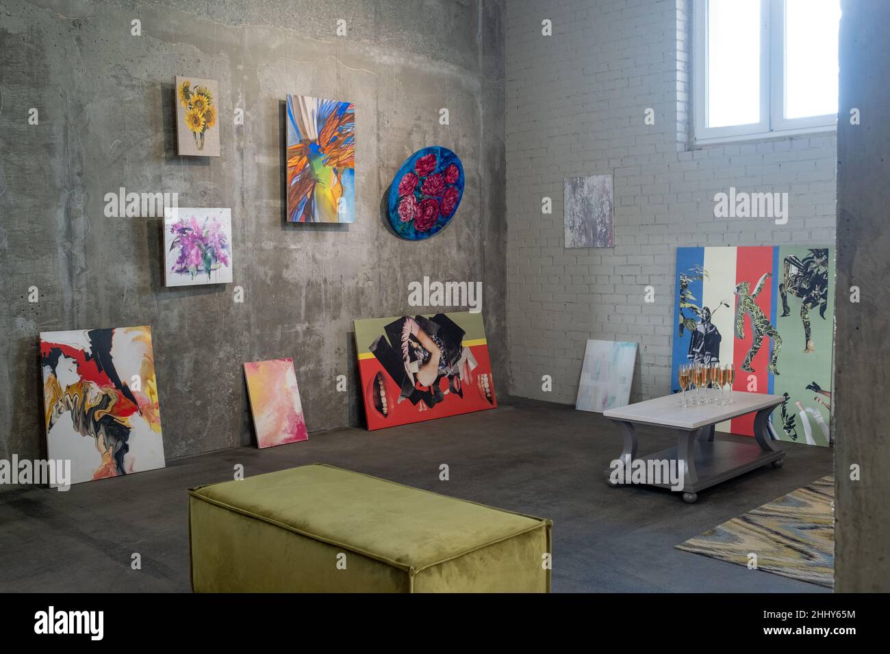 Image of modern paintings hanging on the wall in art studio during exhibition Stock Photo