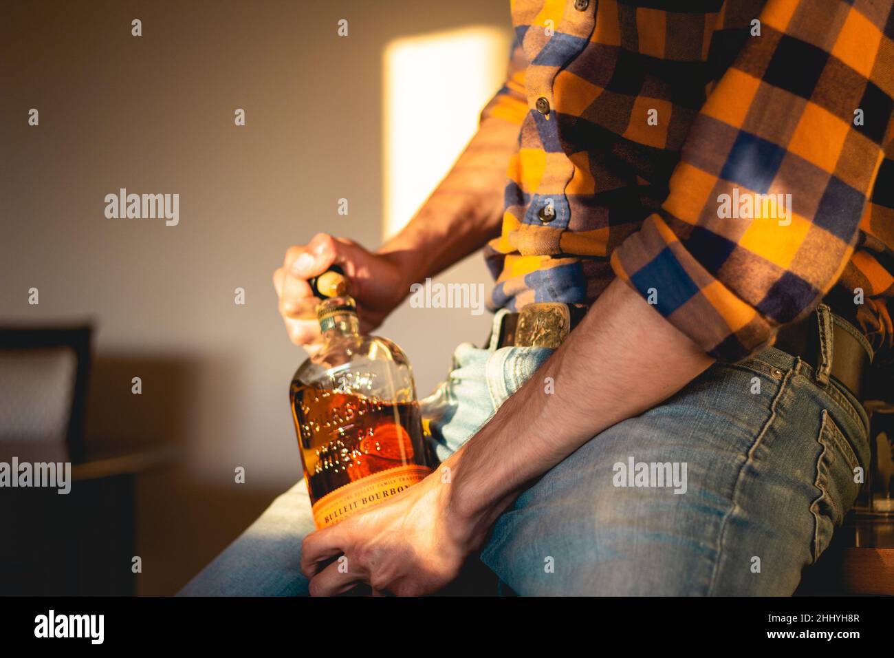 Opening a bottle of whisky Stock Photo Alamy