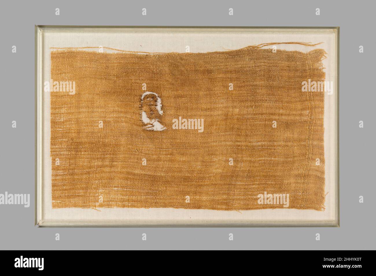 Corner of a Sheet Inscribed with the Cartouche of Neferure ca. 1492–1473 B.C. New Kingdom This fragment of linen is inscribed in ink with the cartouche of Hatshepsut's daughter, Neferure. It came from a bandage used in wrapping of the mummy of Ramose, the father of Senenmut (36.3.252) and husband of Hatnefer (36.3.1). The bandage had been torn from a coarse linen sheet and was 7 1/2 inches wide (19 cm) and almost 15 feet long (455 cm). The original sheet probably came from a storeroom of goods set aside for the use of the princess. An entire sheet used in Ramose's mummy wrappings was also insc Stock Photo
