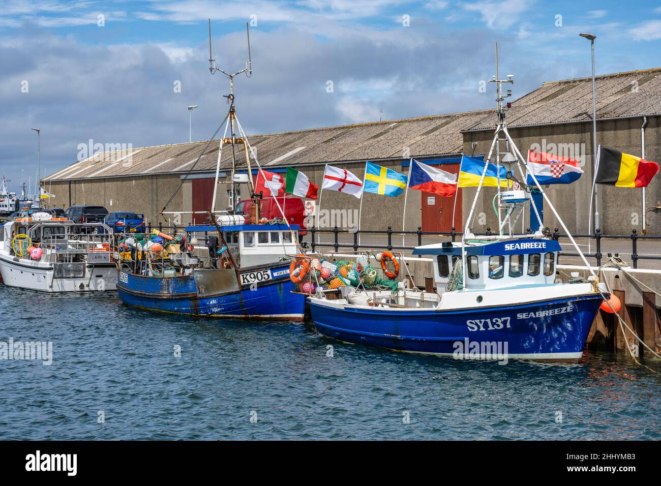 Fishing boats tied up on quayside at Kirkwall harbour in Kirkwall in Orkney, Scotland Stock Photo