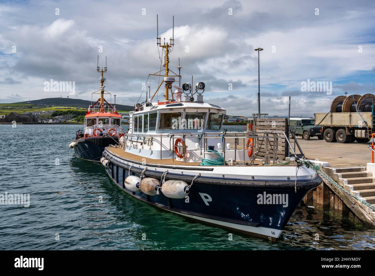 Pilot vessel tied up at entrance to Kirkwall harbour in Kirkwall in Orkney, Scotland Stock Photo