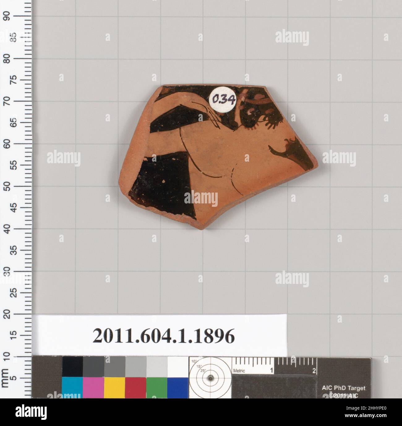 Terracotta rim fragment of a kylix (drinking cup) 520–510 B.C. Greek, Attic Exterior, head, upper torso, and bent right arm of wreathed youth to right. Terracotta rim fragment of a kylix (drinking cup)  683448 Stock Photo