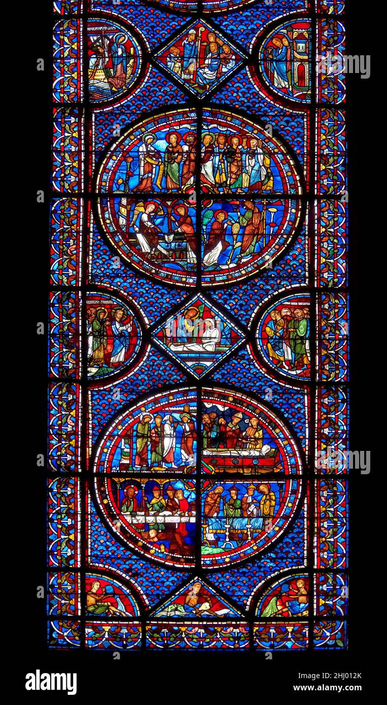 Medieval stained glass Window of the Gothic Cathedral of Chartres, France - dedicated to the Life of St Mary Magdalen. A UNESCO World Heritage Site. Stock Photo