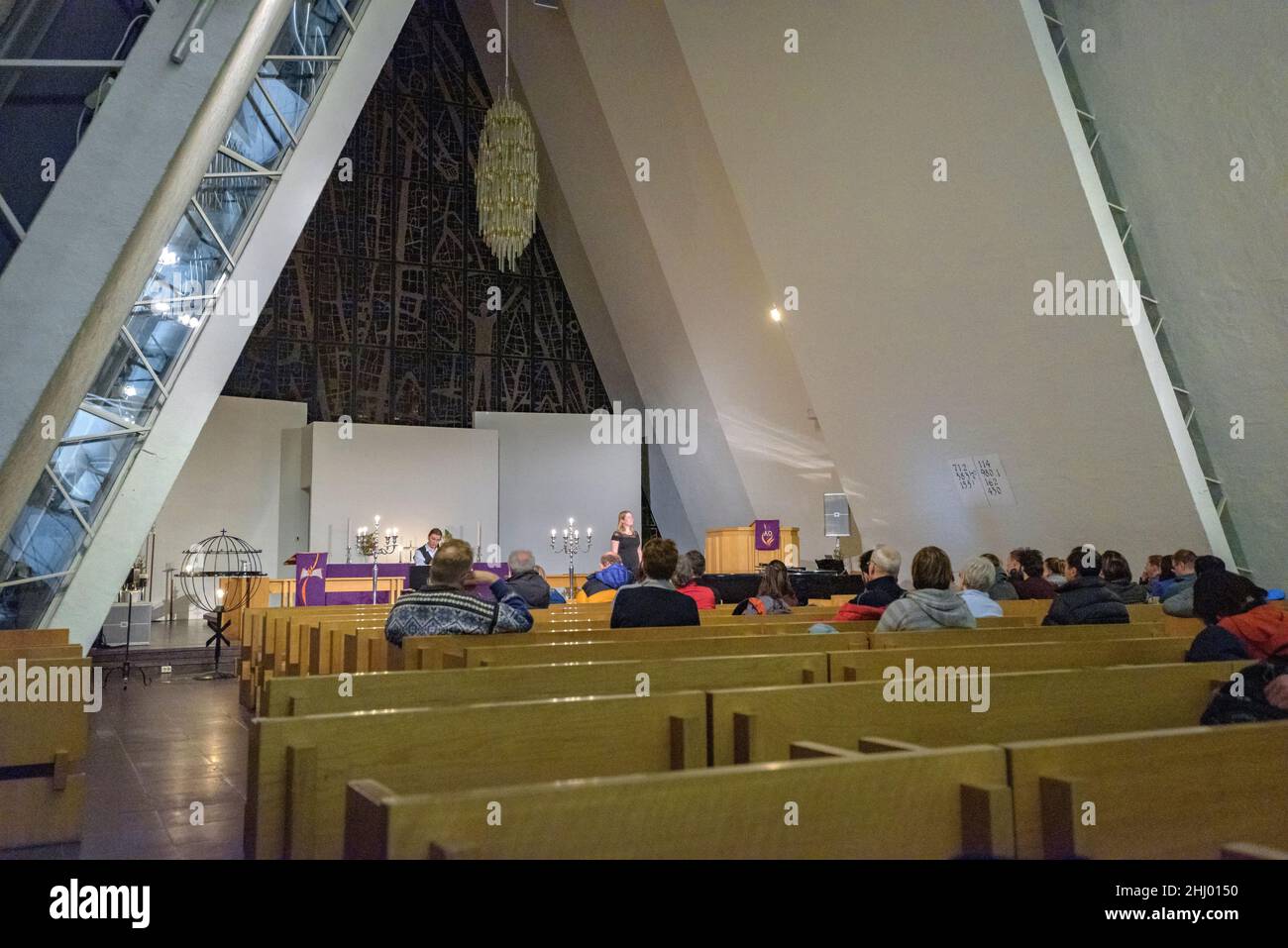 Inside the Arctic Cathedral on a winter night, during a Midnight and Northern Lights Concert (Tromsø, Norway) ESP: Catedral del Ártico, Tromsø Noruega Stock Photo