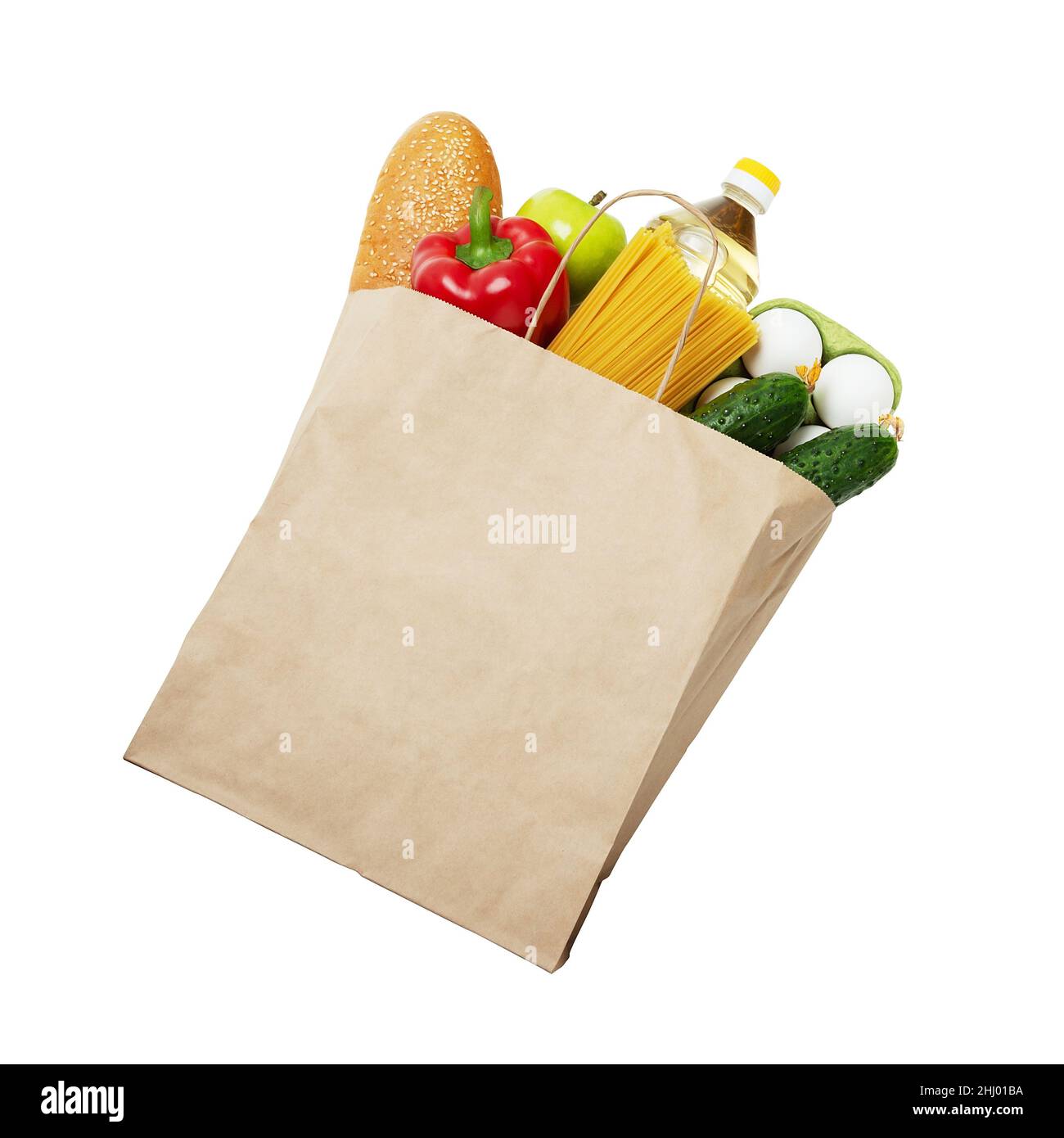 Healthy nutrition in mock up paper bag isolated on white background. Concept of Zero waste, eco-friendly shopping, food donation, food delivery.  Stock Photo
